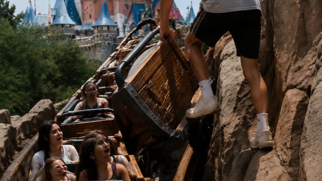 Teen Takes Risk at Disneyland: Climbs Ride Mid-Adventure